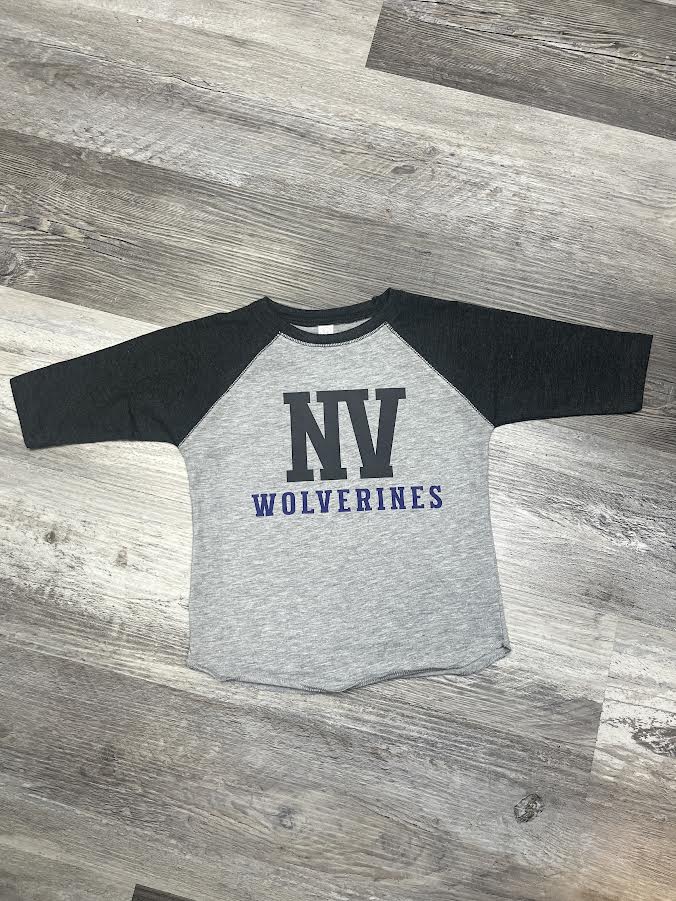Gray and black baseball shirt with 'NV Wolverines' text on a wooden floor.