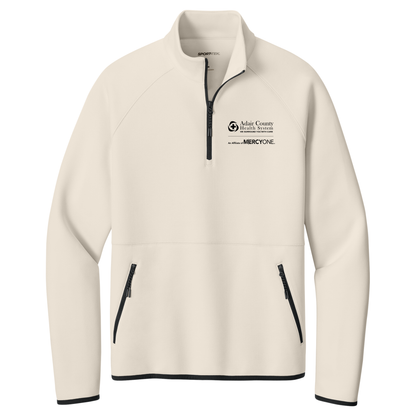 Beige fleece jacket with black zippers on a white background